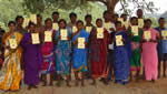Tribal people in Orissa demonstrating land certificates they obtained with the help of the project